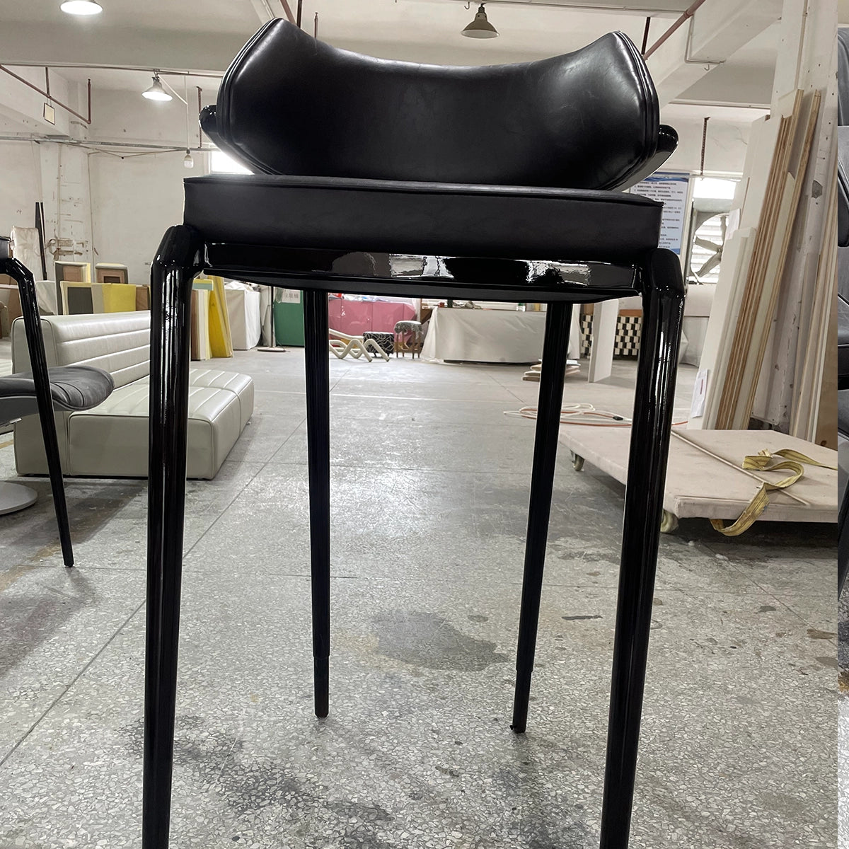 Modern Black Leather High-Leg Chair with Sleek Design